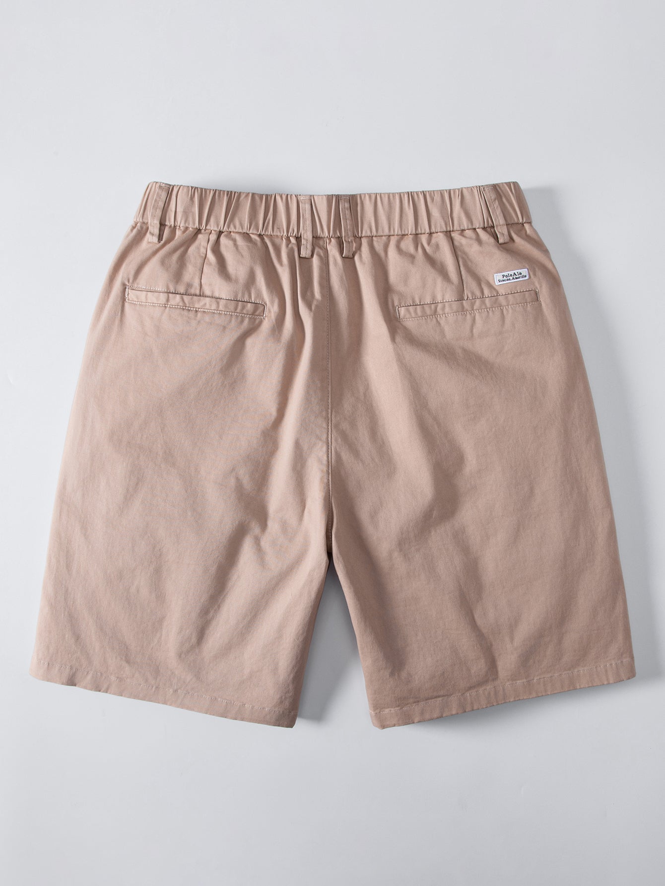 Polo de punto con cremallera texturizada y ribetes en contraste y pantalones cortos chino con cintura elástica