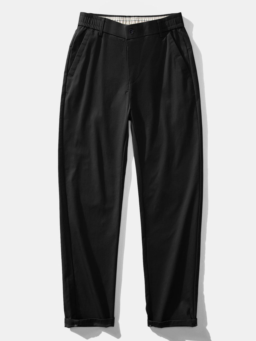Polo de punto con cremallera texturizada y ribetes en contraste, y pantalones de corte recto con cintura elástica