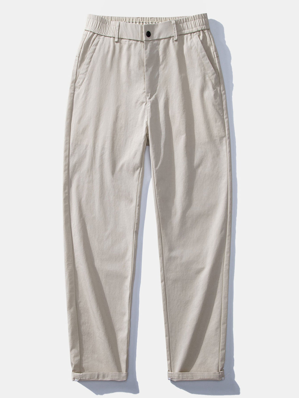 Polo de punto con cremallera texturizada y ribetes en contraste, y pantalones de corte recto con cintura elástica