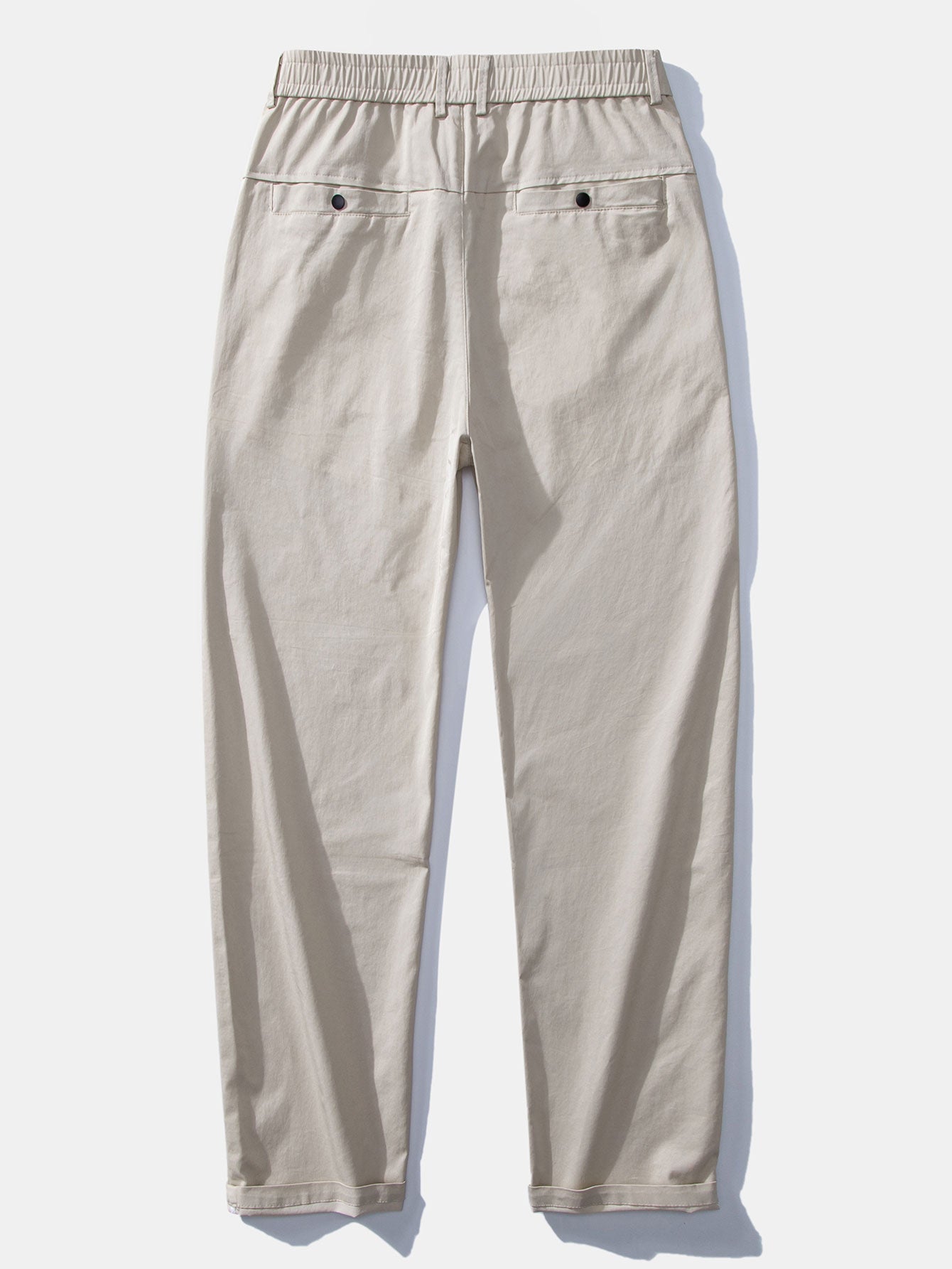 Polo de punto con cremallera texturizada y ribetes en contraste, y pantalones de corte recto con cintura elástica