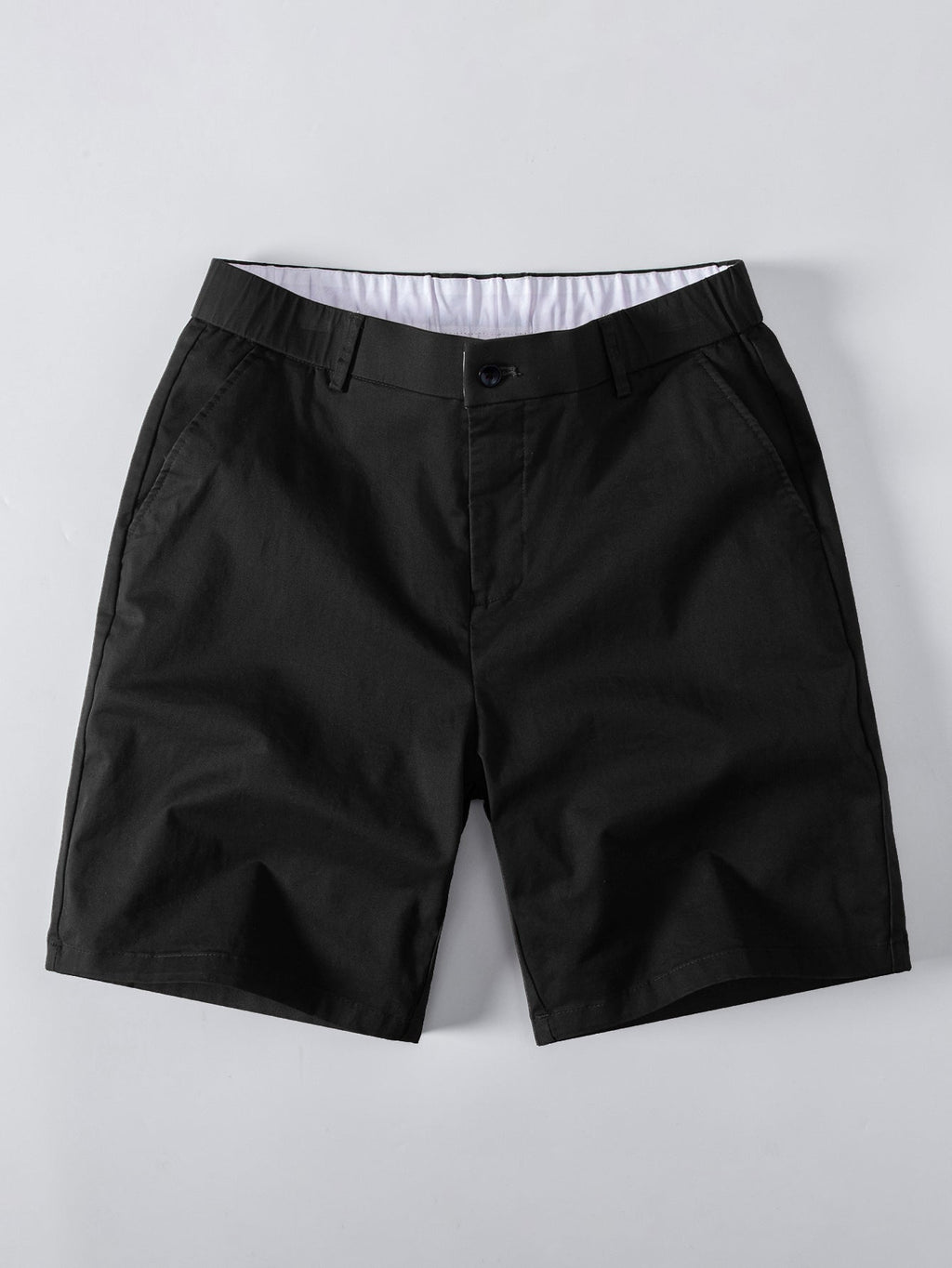 Polo de punto con cremallera texturizada y ribetes en contraste y pantalones cortos chino con cintura elástica