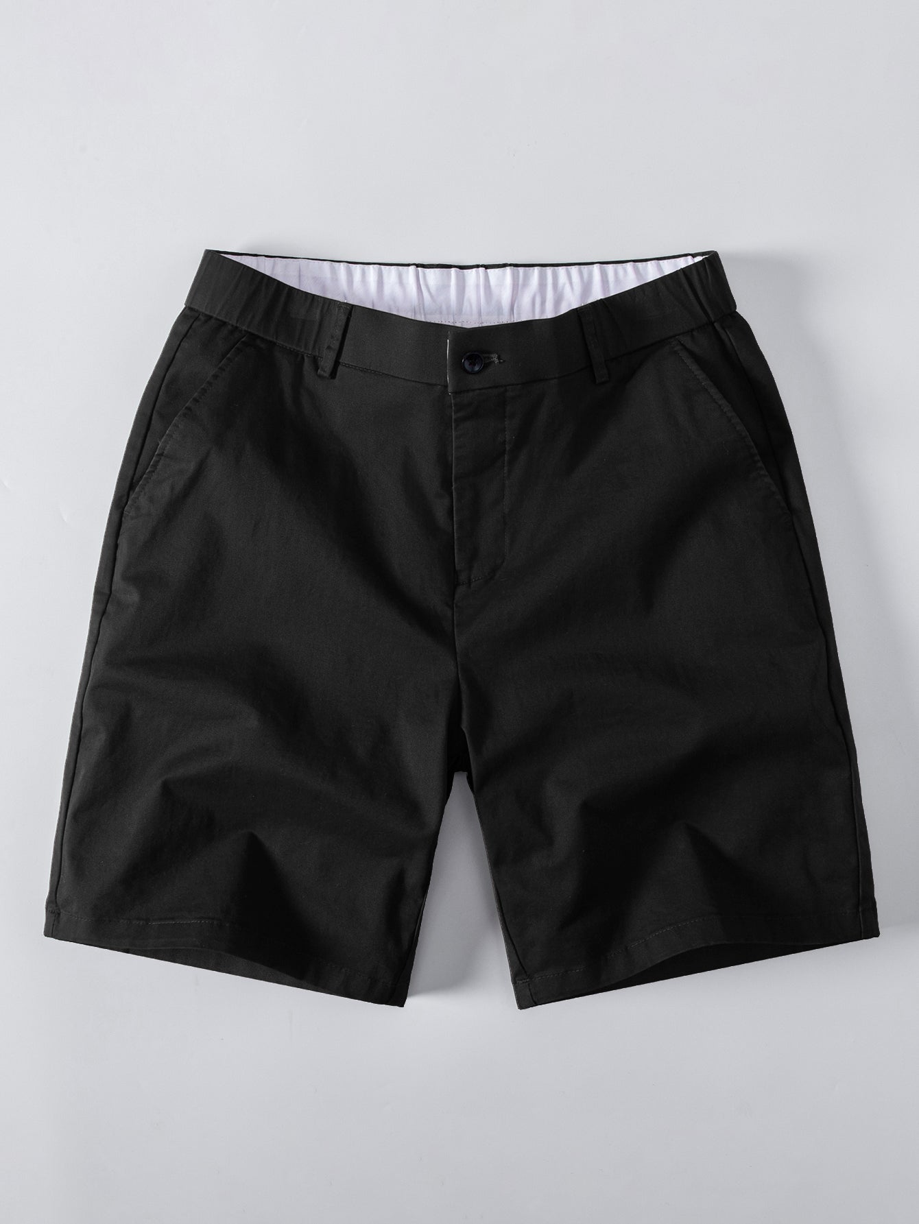 Polo de punto con cremallera texturizada y ribetes en contraste y pantalones cortos chino con cintura elástica